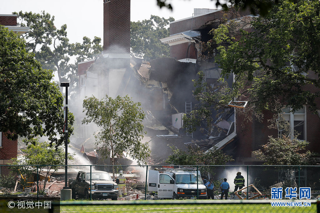 Emergency personnel put water on the scene of school building collapse at Minnehaha Academy in Minneapolis, Minnesota, U.S., August 2, 2017. Adam Bettcher